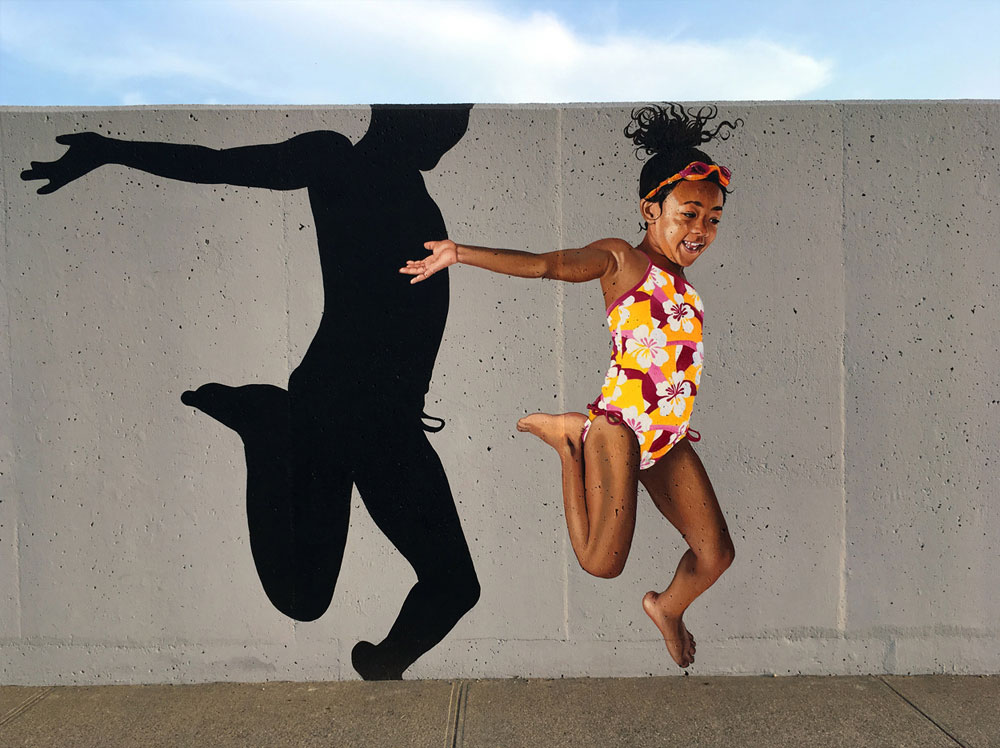 Woonsocket Kids Mural Painted on Retaining Walls by Bonnie Lee Turner and Charles C. Clear III of The Art Of Life