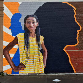 Profiles in Courage Mural painted by Bonnie Lee Turner and Charles C. Clear III on the exterior of Beacon Carter School in Woonsocket, RI